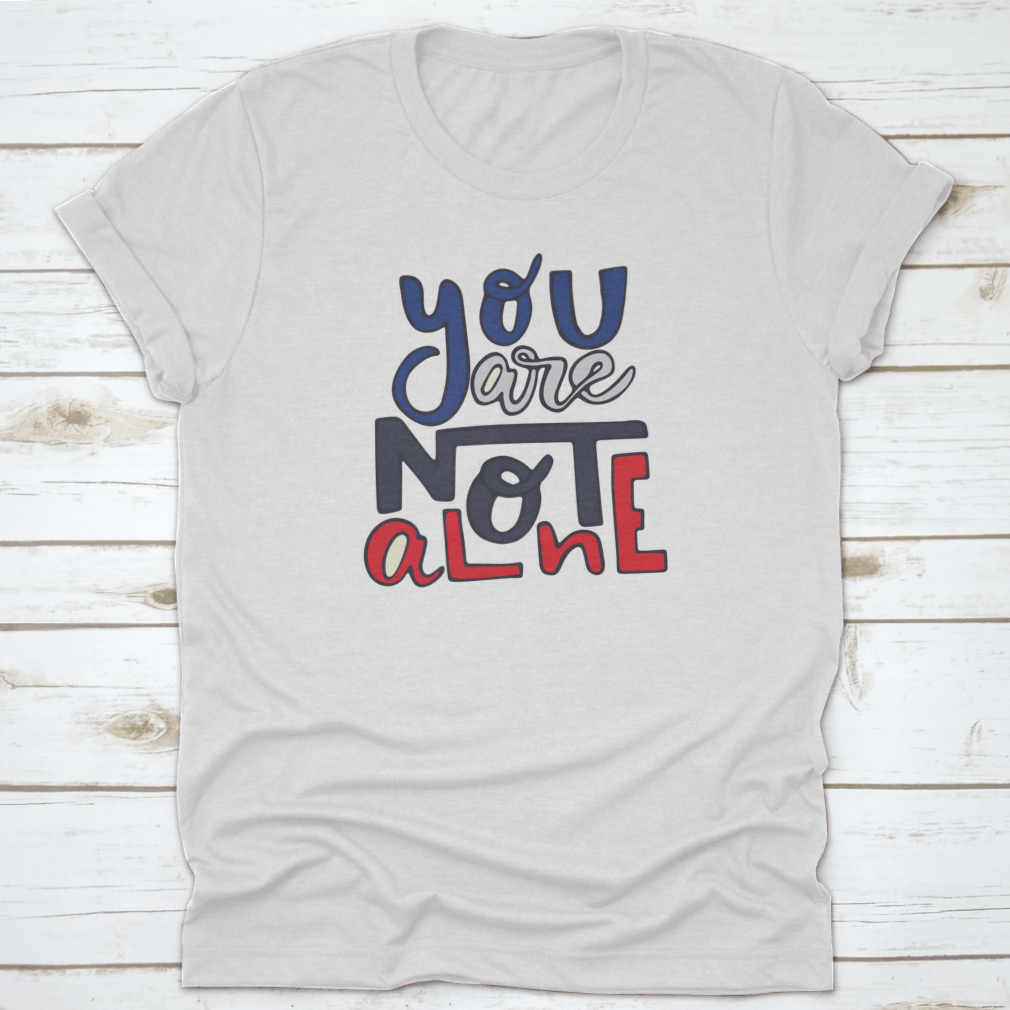 A soft cotton shirt featuring the inspirational quote 'You Are Not Alone' in a stylish design, perfect for casual wear.