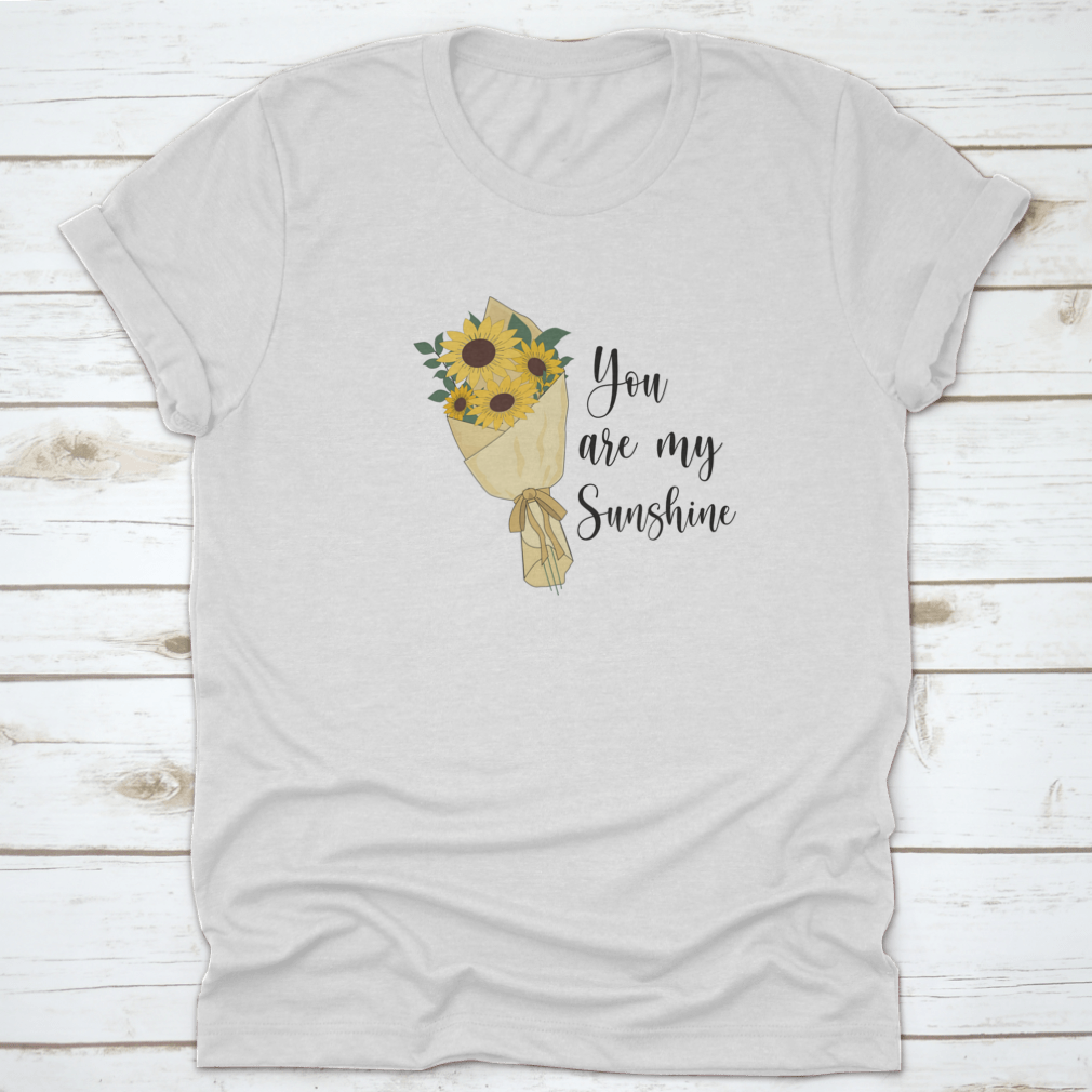 You Are Sunshine T-shirt featuring a vibrant sunflower watercolor design, made from soft cotton fabric.