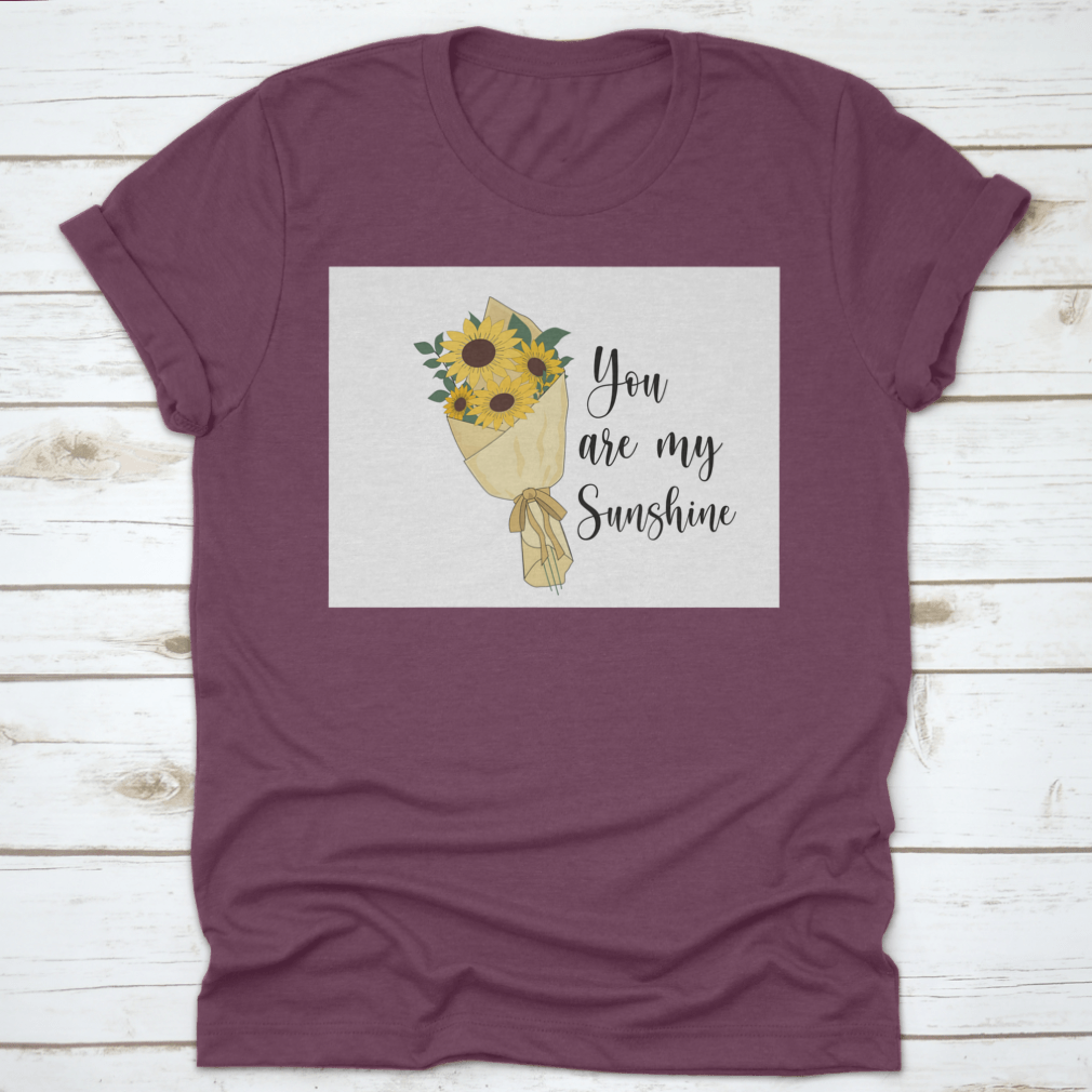 You Are Sunshine T-shirt featuring a vibrant sunflower watercolor design, made from soft cotton fabric.