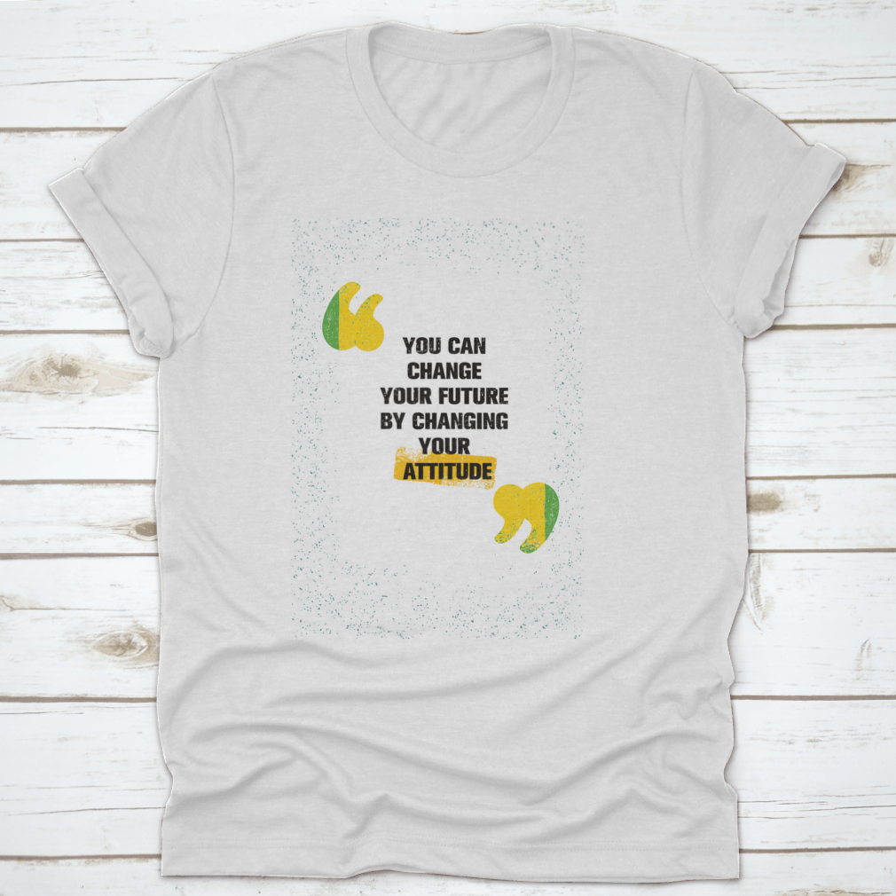 A modern t-shirt featuring the motivational phrase 'You Can Change Your Future By Changing Your Attitude', made from soft cotton fabric.