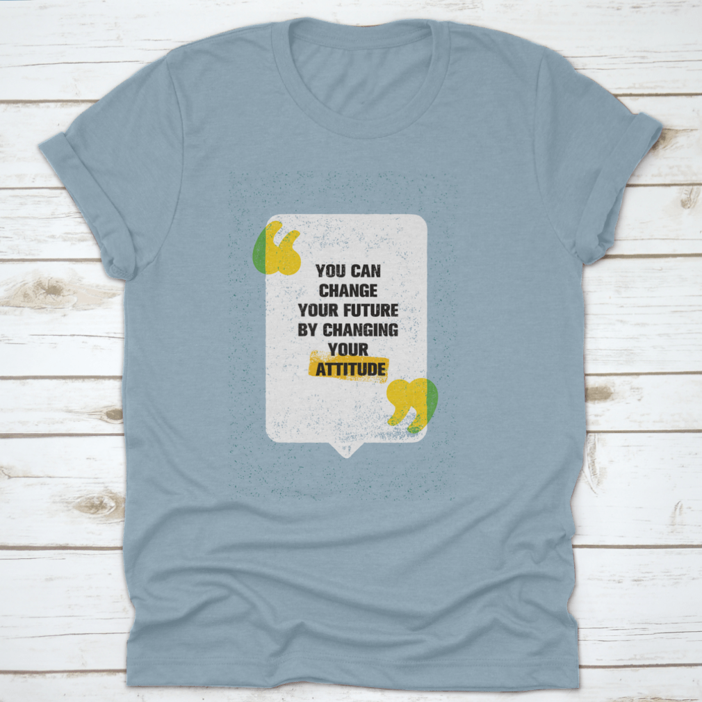 A modern t-shirt featuring the motivational phrase 'You Can Change Your Future By Changing Your Attitude', made from soft cotton fabric.