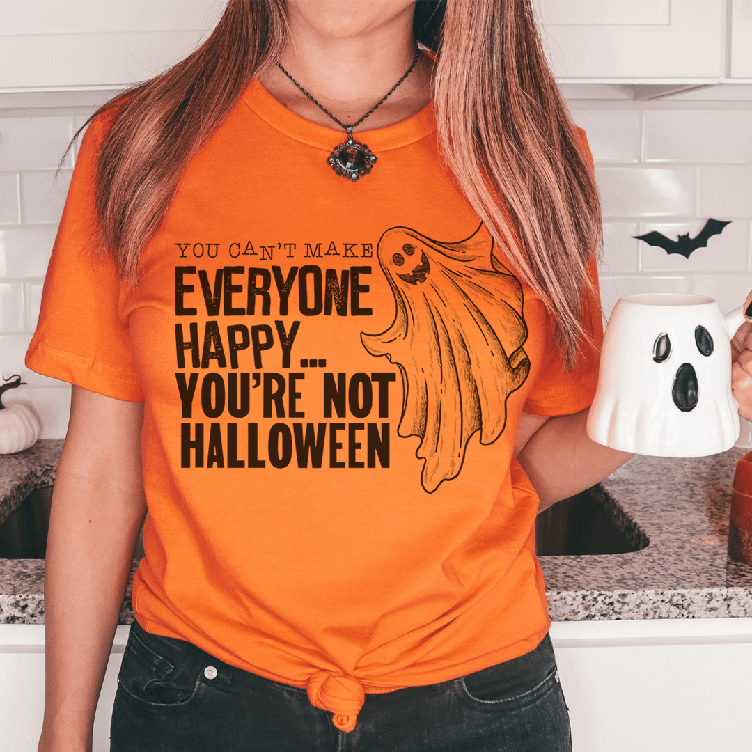 A black Halloween tee featuring the phrase 'You Can't Make Everyone Happy You're Not Halloween' in bold white letters, made from 100% soft cotton.