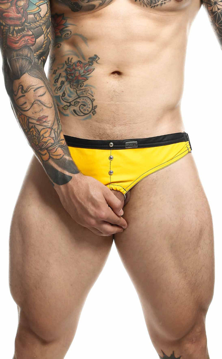 C-Ring Jockstrap Faux Leather by DNGEON featuring bold metal studs and wide straps, designed for comfort and style.