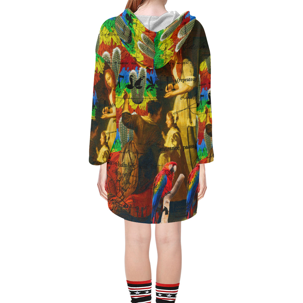 A vibrant unisex tunic hoodie featuring a drawstring hood, v-neckline, and oversized silhouette with colorful collage prints.