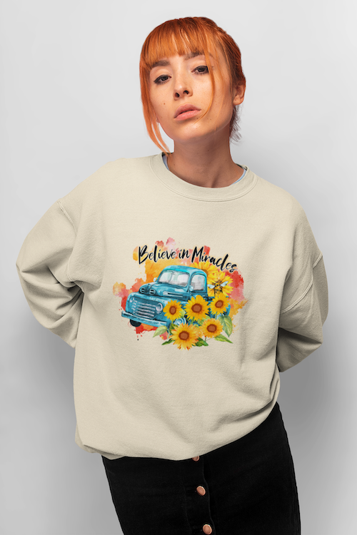 A cozy sunflower sweatshirt featuring a vibrant sunflower design, made from a soft cotton-polyester blend.