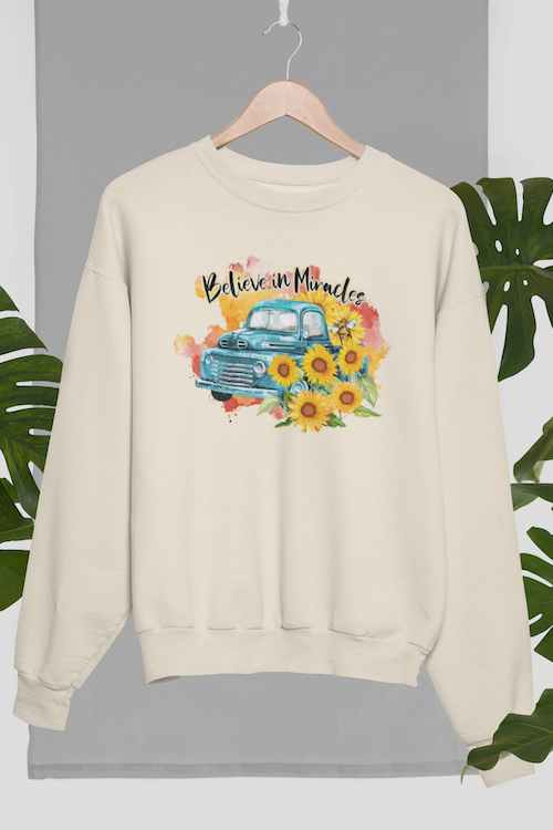 A cozy sunflower sweatshirt featuring a vibrant sunflower design, made from a soft cotton-polyester blend.