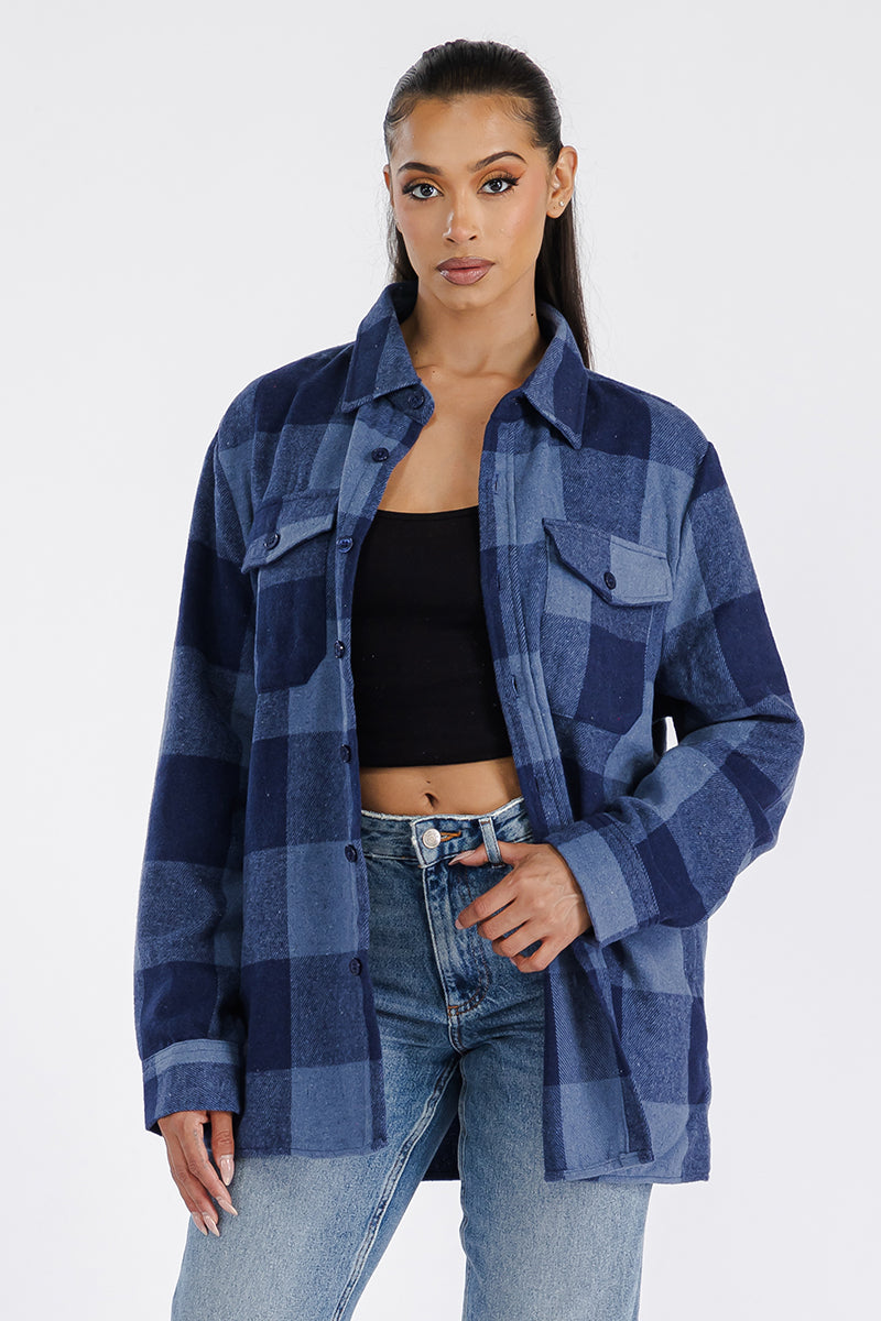 A stylish oversized flannel shacket in soft brushed fabric, featuring button closure and chest pockets, perfect for casual layering.
