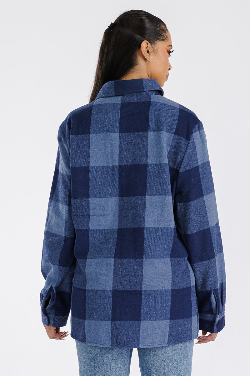 A stylish oversized flannel shacket in soft brushed fabric, featuring button closure and chest pockets, perfect for casual layering.