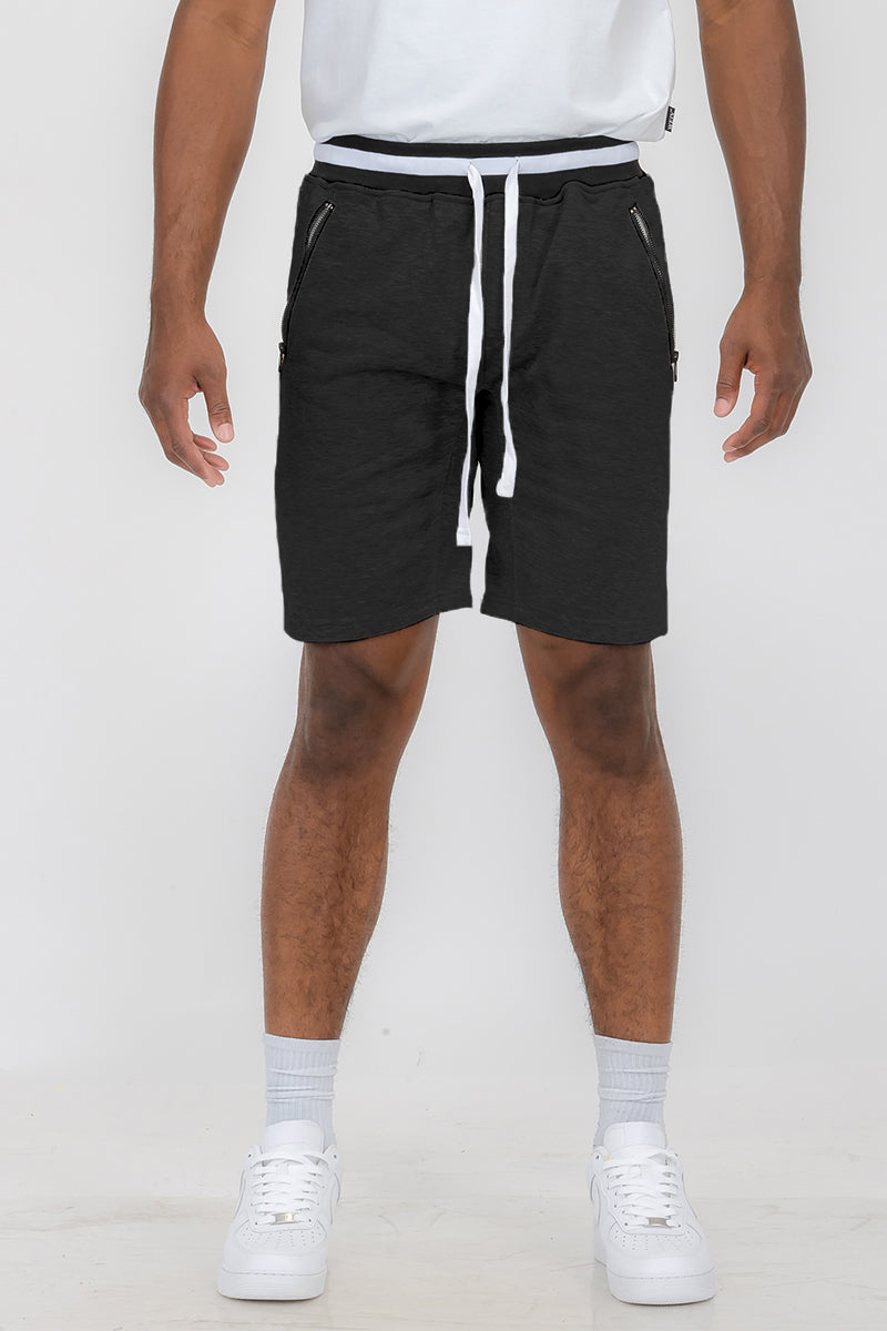 Man in black drawstring shorts.