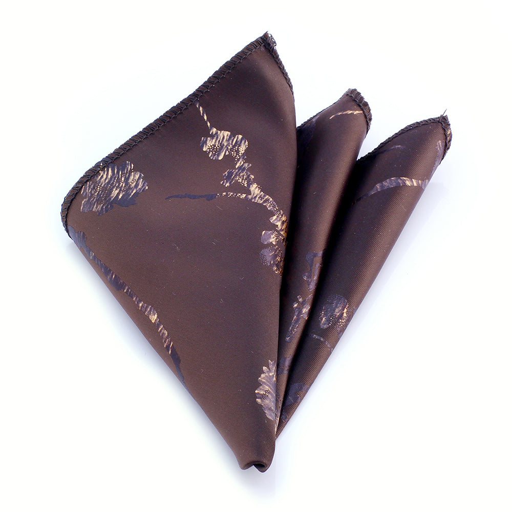 Brown and white mens pocket square made of premium jacquard woven silk, elegantly folded and displayed in a protective bag.