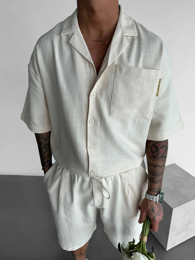 Men's beach vacation shorts set in solid color, featuring drawstring closure and short sleeves, perfect for summer outings.