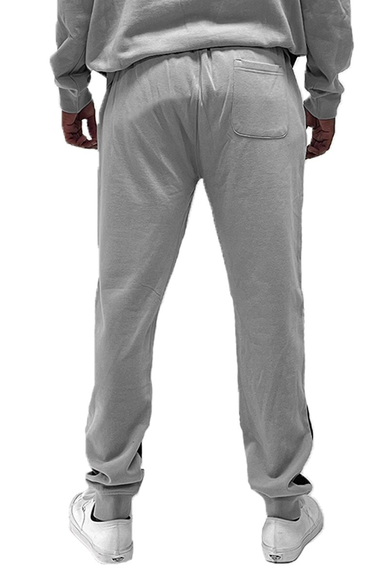 Color Block Sweats featuring an elastic waist, drawstring, and ribbed ankle cuffs in a stylish design.