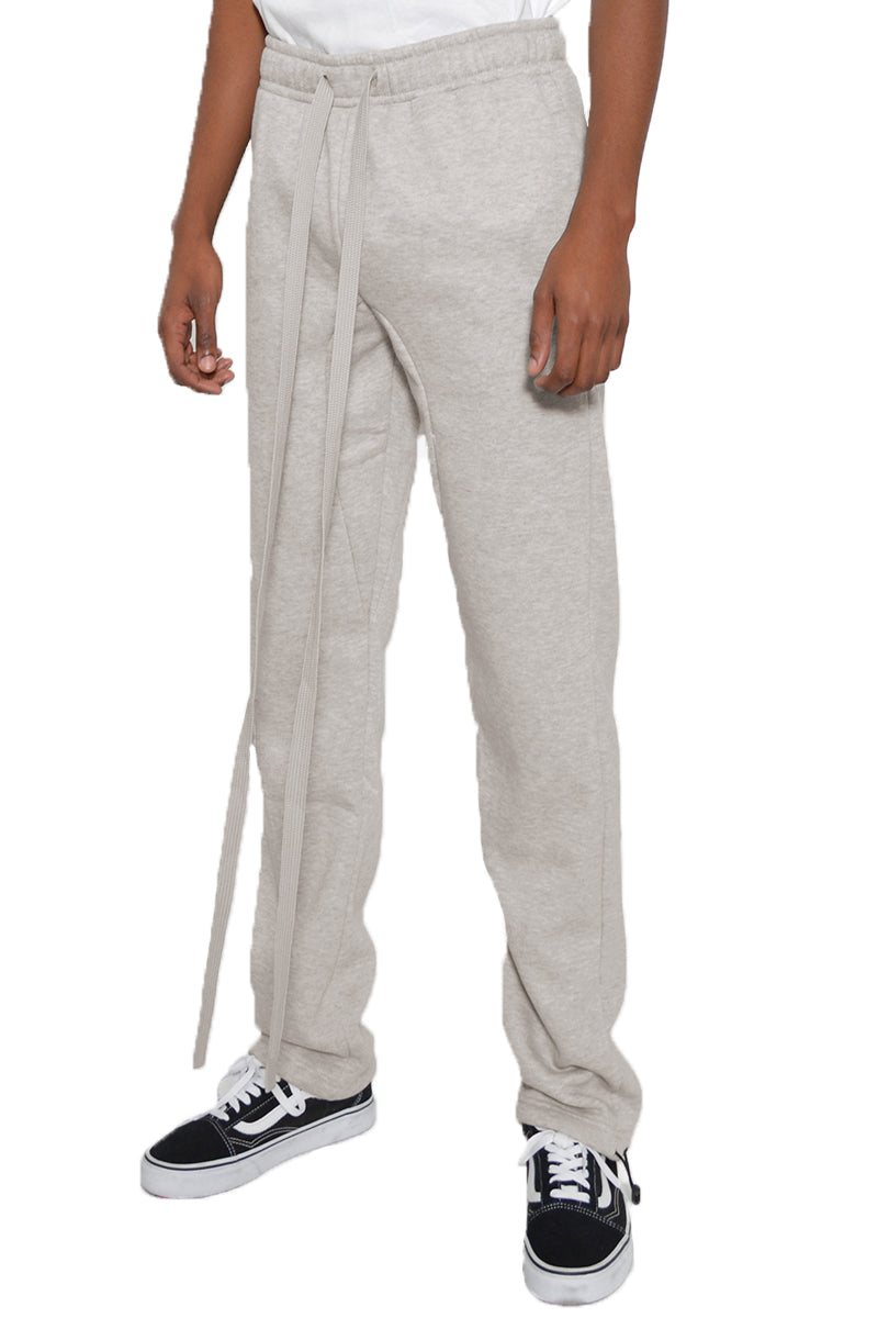 Cotton Fleece Toggle Sweats in a stylish setting, showcasing the elastic waist and ankle toggle design.