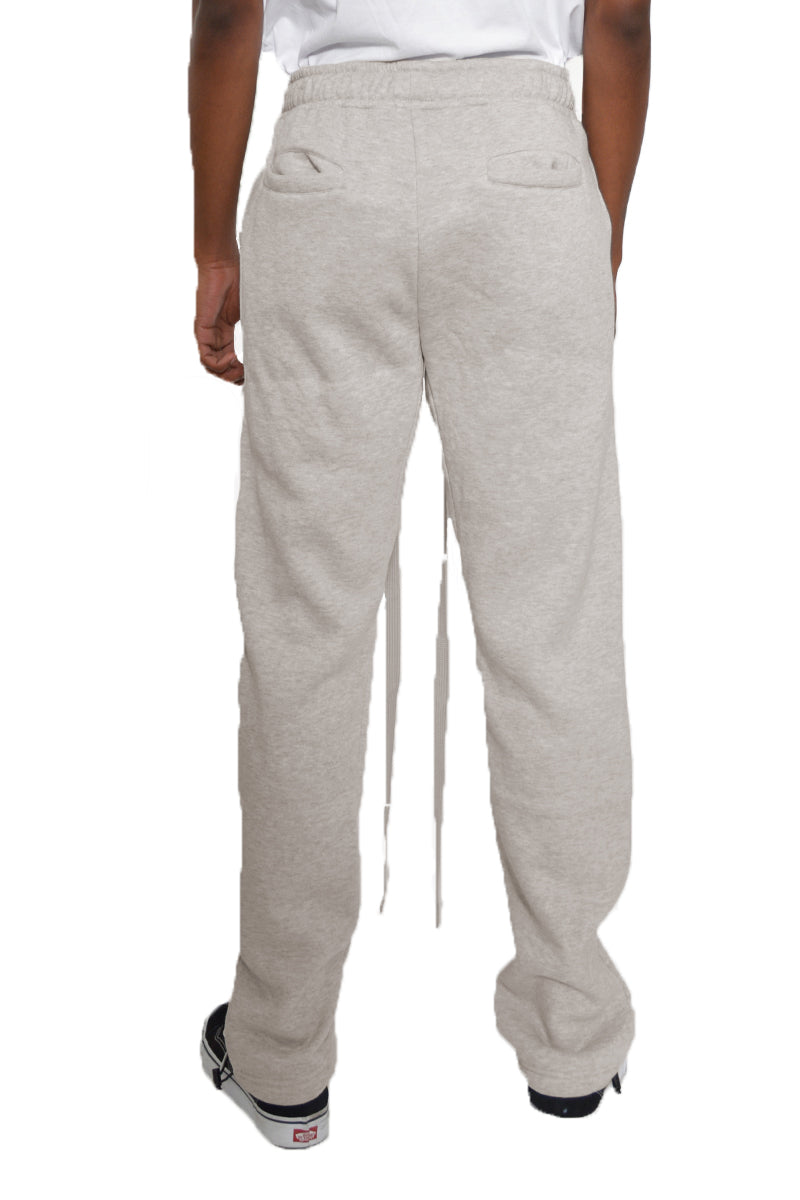 Cotton Fleece Toggle Sweats in a stylish setting, showcasing the elastic waist and ankle toggle design.