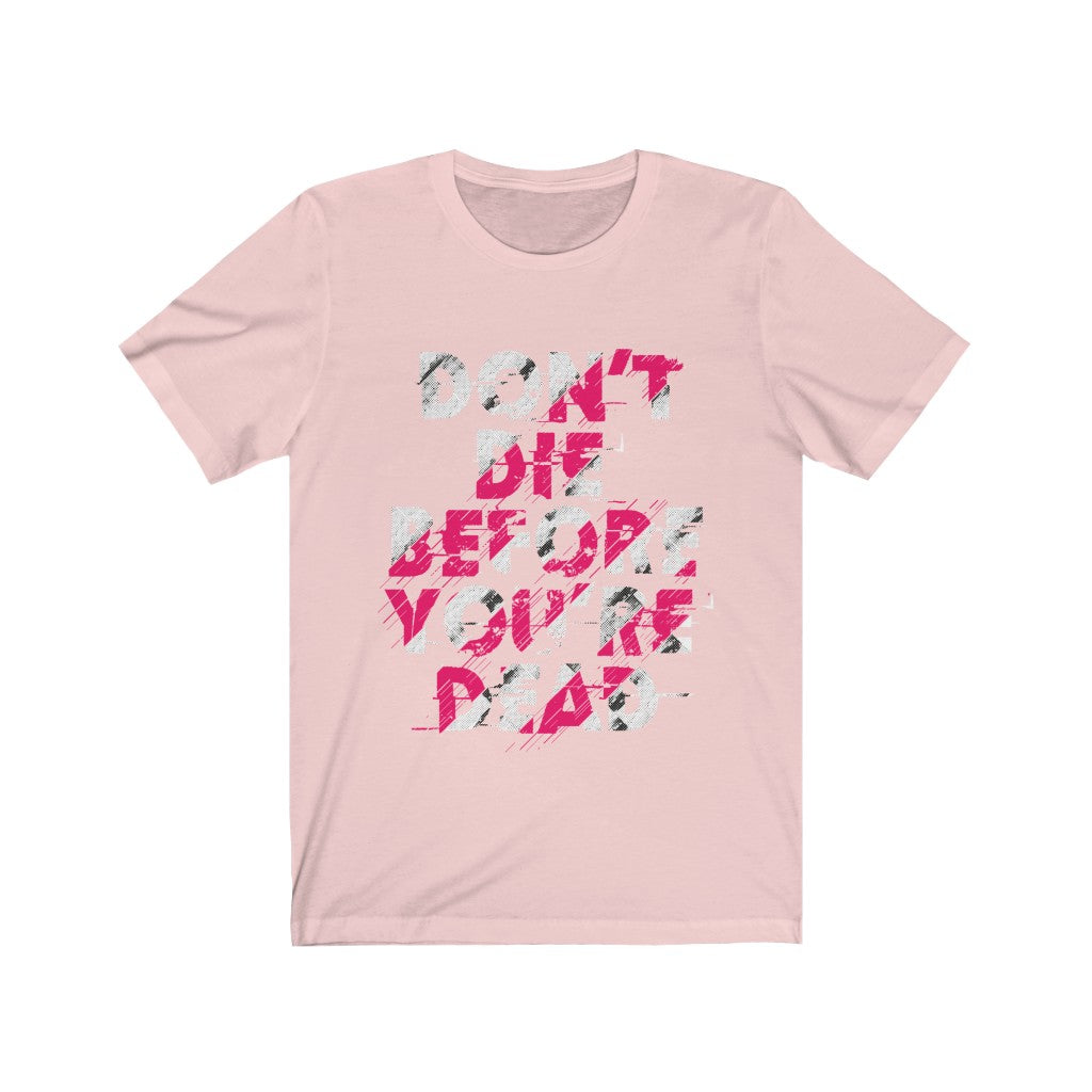 A unisex T-shirt featuring the motivational quote 'Don't Die Before You're Dead' printed in bold vinyl on soft cotton fabric.