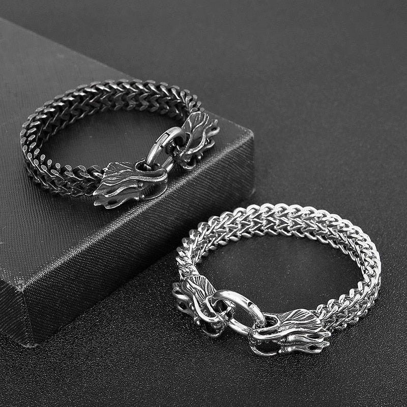 A stylish Double Dragon Chain Bracelet featuring gold plated links and a bold hip hop design, available in black and silver colors.