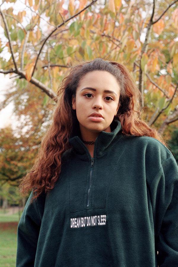 Forest Green fleece sweatshirt featuring 'Dream But Do Not Sleep' embroidered design on the front, showcasing its cozy and stylish appeal.