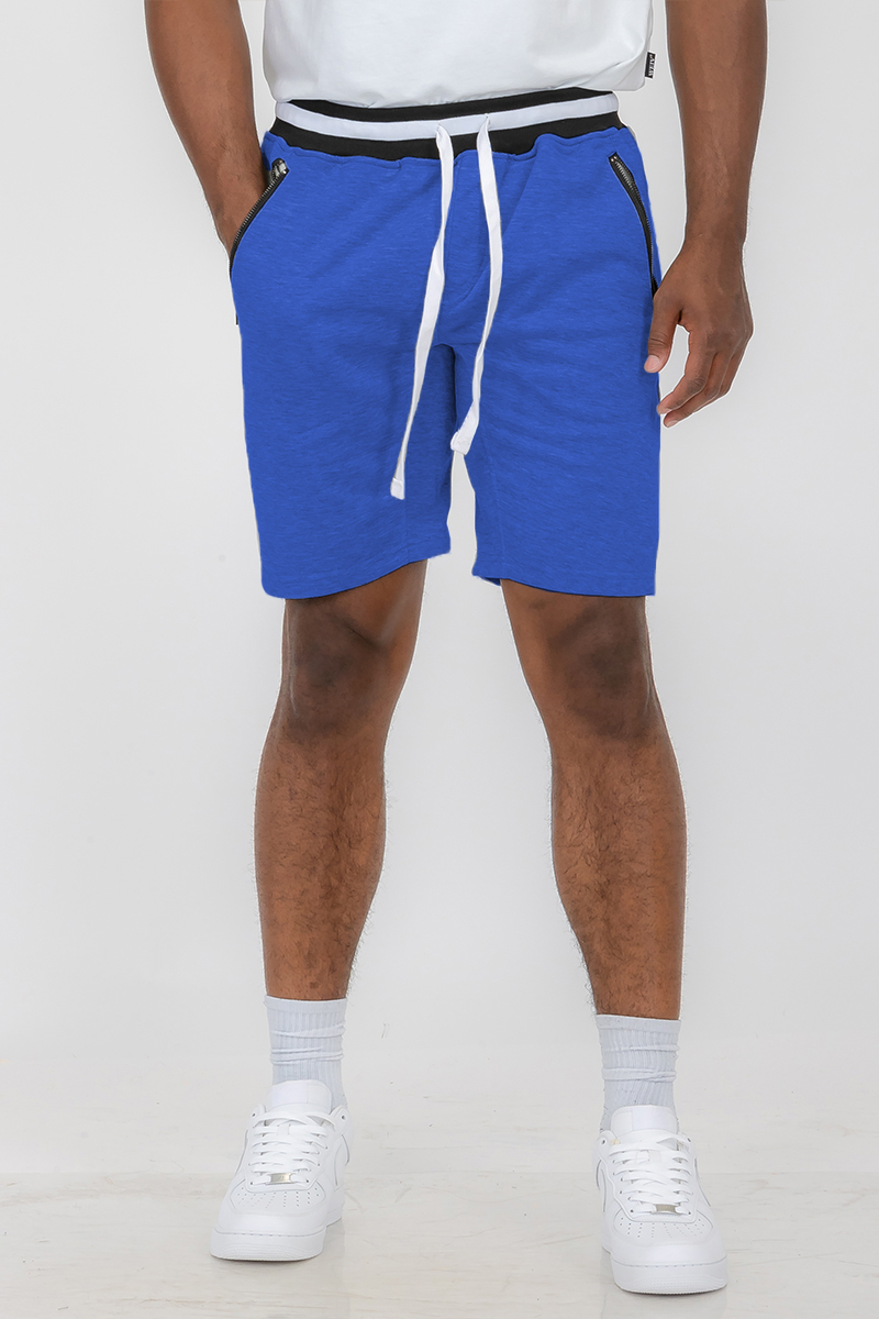 A pair of French Terry Sweat Shorts featuring an elastic waistband and standard pockets, made from a soft polyester and spandex blend.