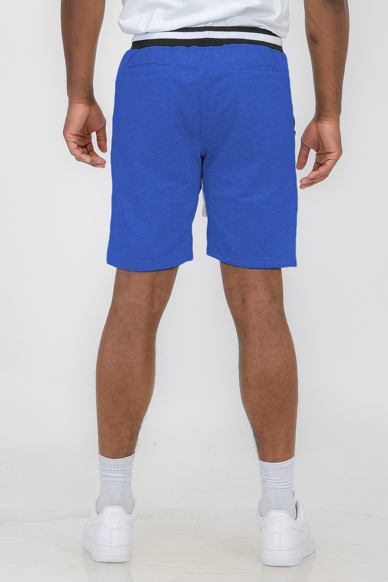A pair of French Terry Sweat Shorts featuring an elastic waistband and standard pockets, made from a soft polyester and spandex blend.