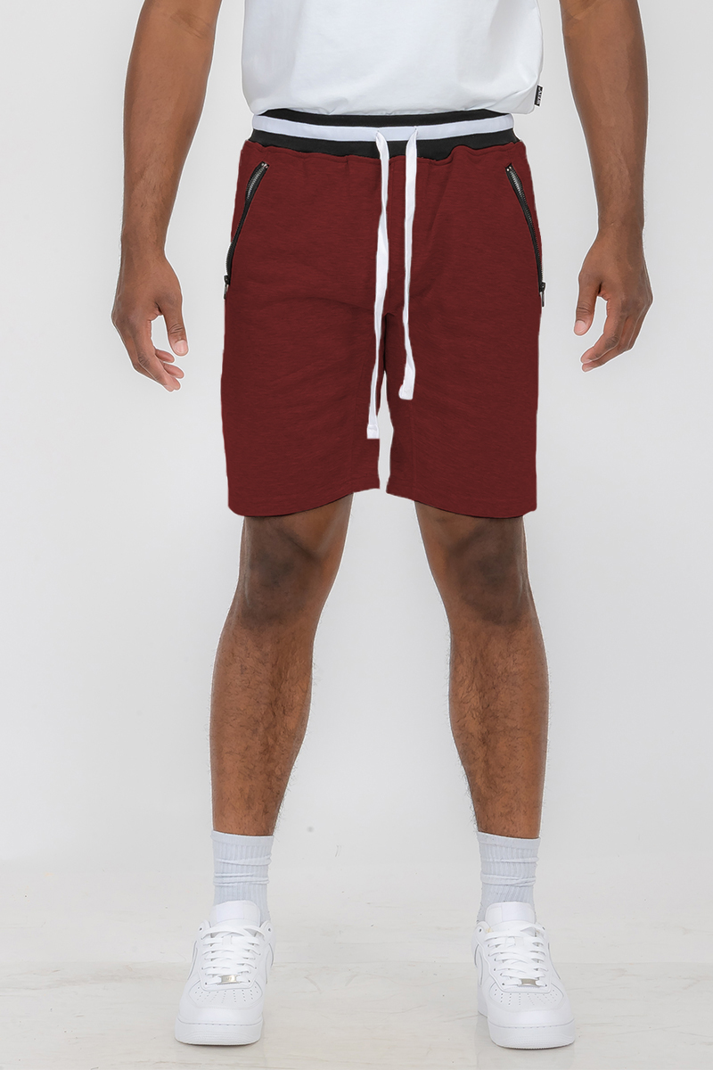 A pair of French Terry Sweat Shorts featuring an elastic waistband and drawstring, made from a soft polyester and spandex blend, with standard pockets.