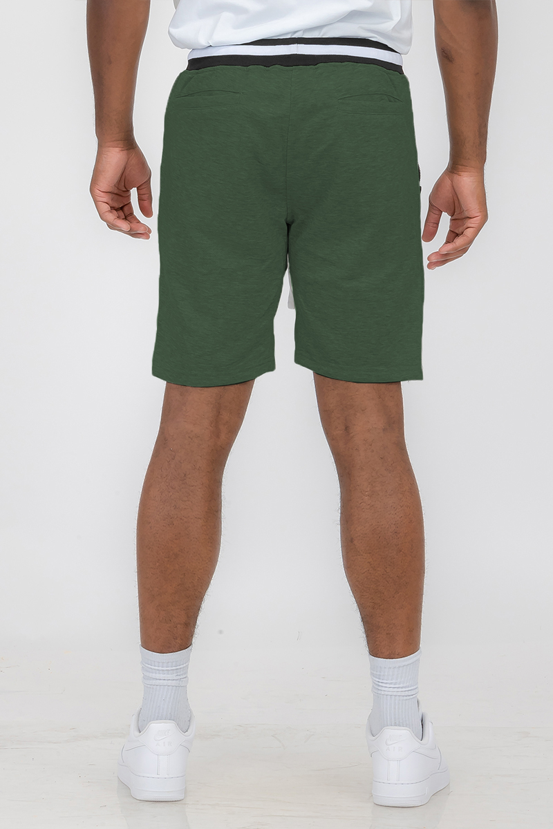 A pair of stylish French Terry Sweat Shorts in a soft fabric, featuring an elastic waistband with a drawstring and standard pockets.