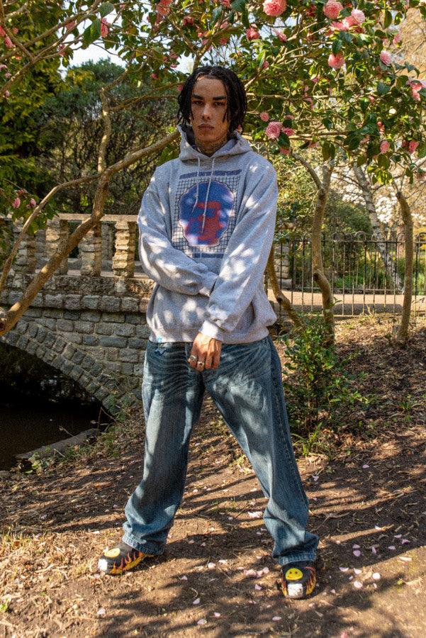 Heavyweight grey hoodie featuring Lost in Motion print, showcasing a relaxed fit and stylish design.