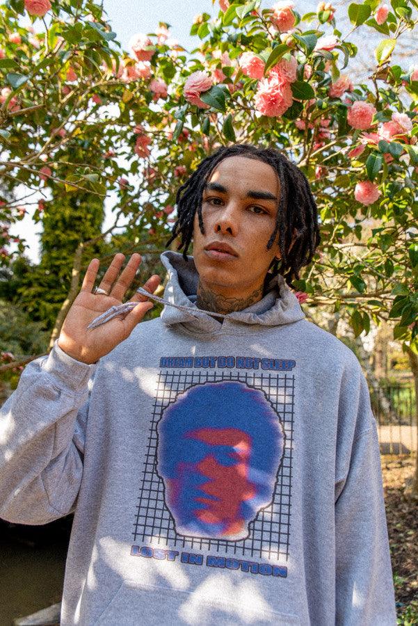 Heavyweight grey hoodie featuring Lost in Motion print, showcasing a relaxed fit and stylish design.