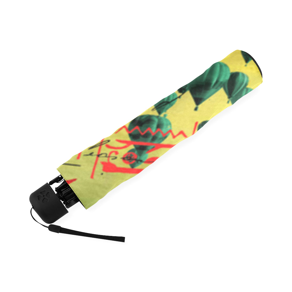 HERE, TAKE IT II Foldable Umbrella showcasing vibrant prints and durable construction, perfect for rainy days.