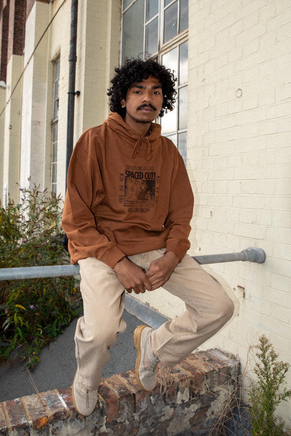 Caramel Toffee Hoodie featuring Spaced Out! print, showcasing its vibrant design and heavyweight cotton material.