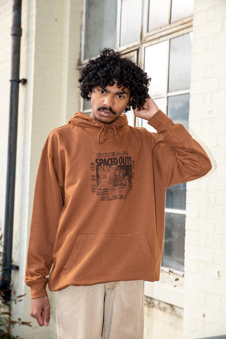 Caramel Toffee Hoodie featuring Spaced Out! print, showcasing its vibrant design and heavyweight cotton material.