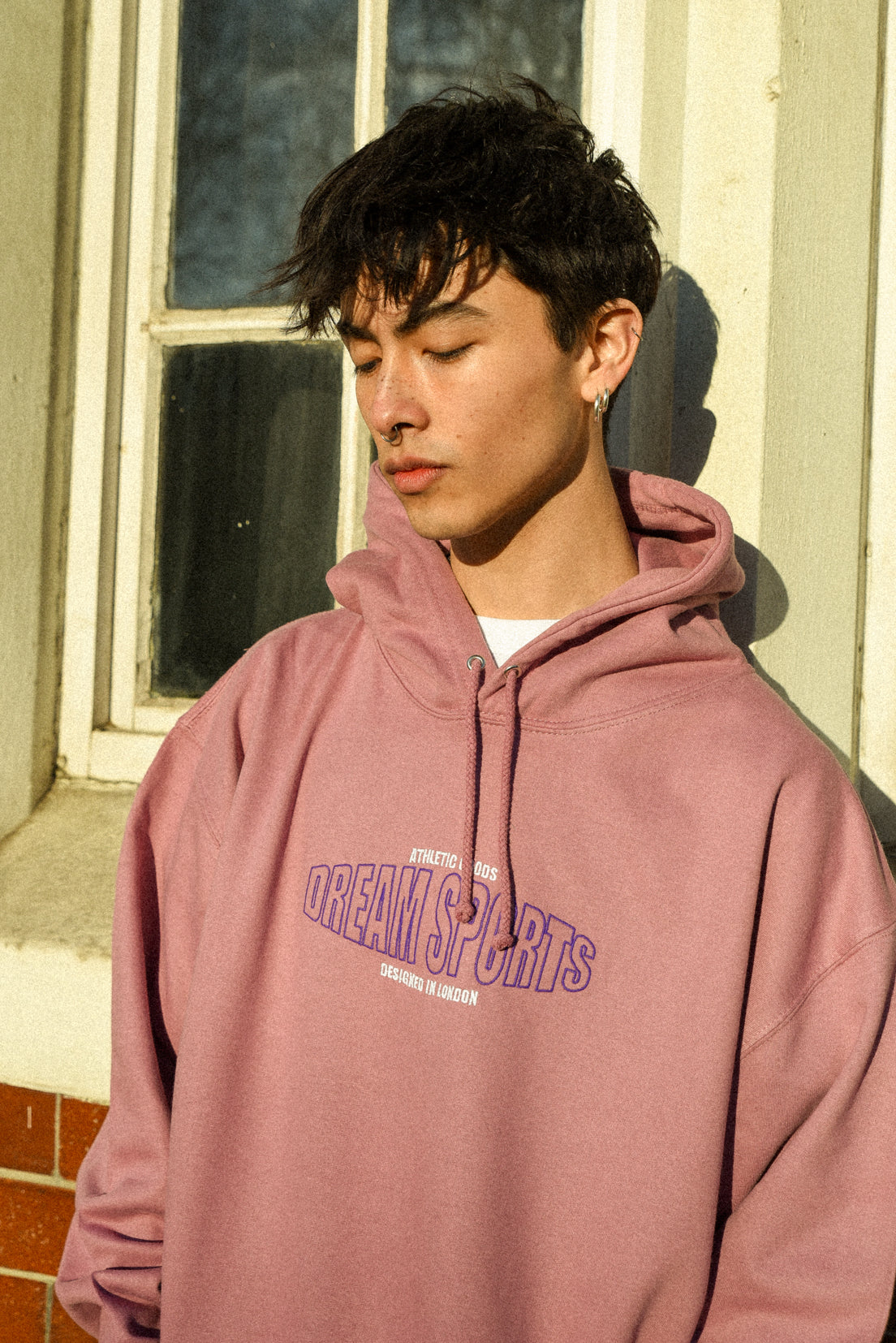 Dusty Purple unisex hoodie featuring Dream Sports embroidery, showcasing a relaxed fit and heavyweight cotton fabric.