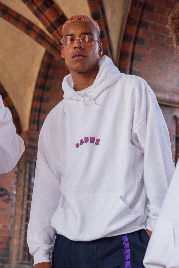 White hoodie featuring a vibrant grape bubble logo print, showcasing a relaxed fit and woven label details.