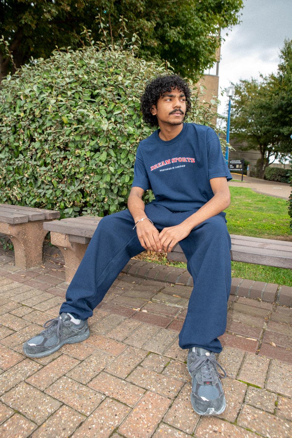 Navy joggers featuring Dream Sports embroidery, showcasing a relaxed fit and heavyweight fabric, perfect for casual wear.