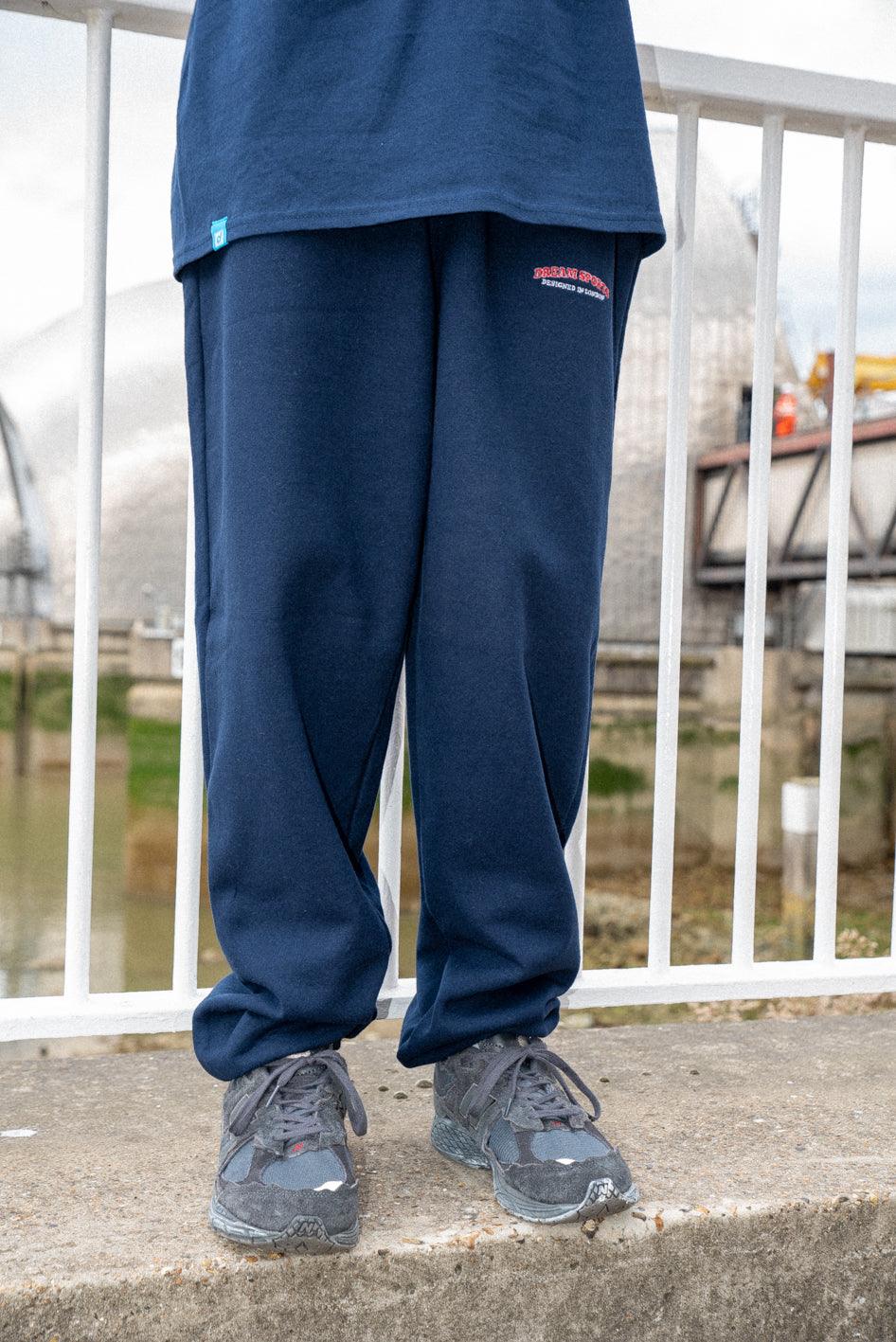Navy joggers featuring Dream Sports embroidery, showcasing a relaxed fit and heavyweight fabric, perfect for casual wear.