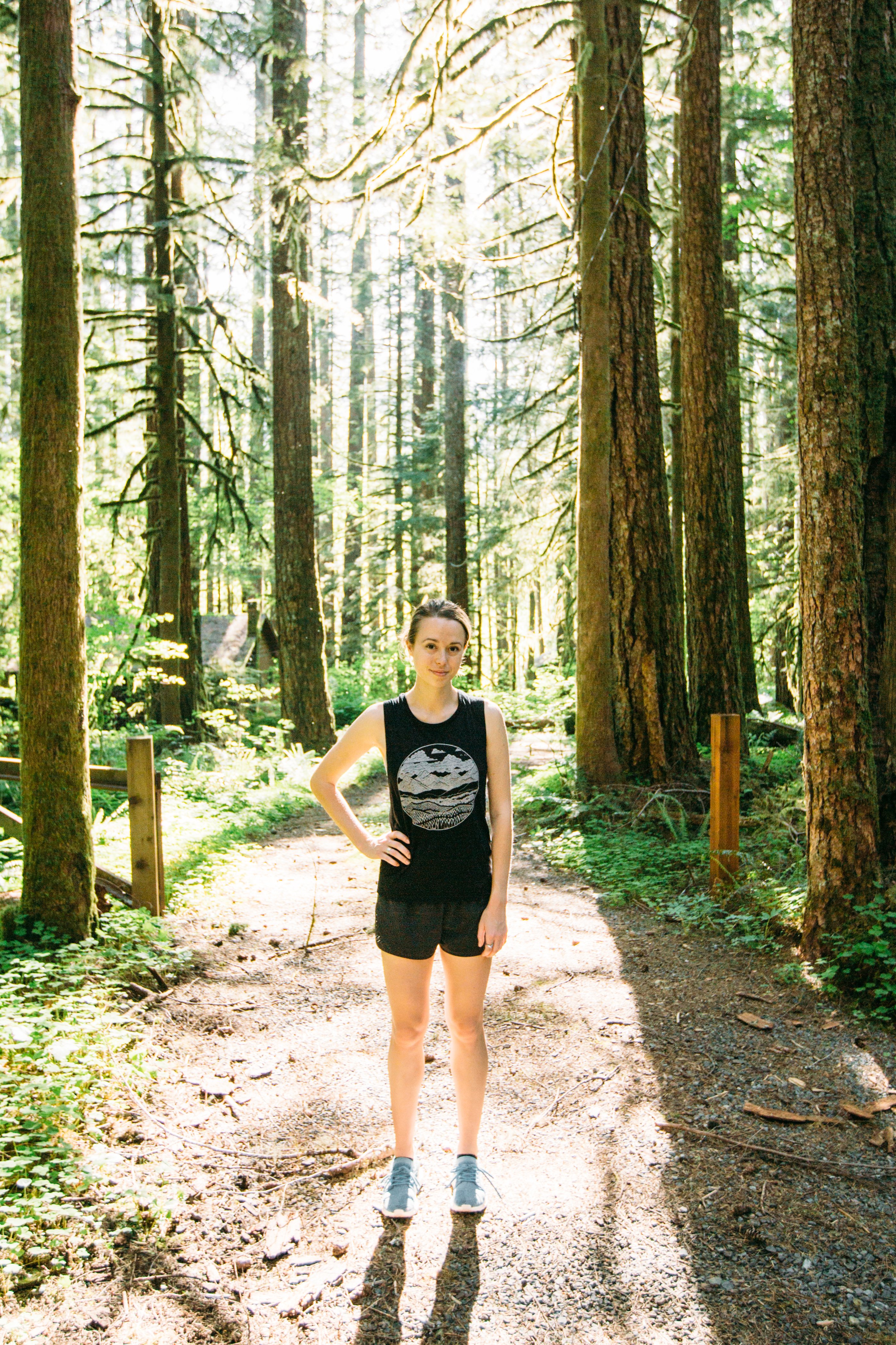 Ladies Mountain Range Muscle Tank in black featuring a mountain range design, made from soft ringspun cotton.