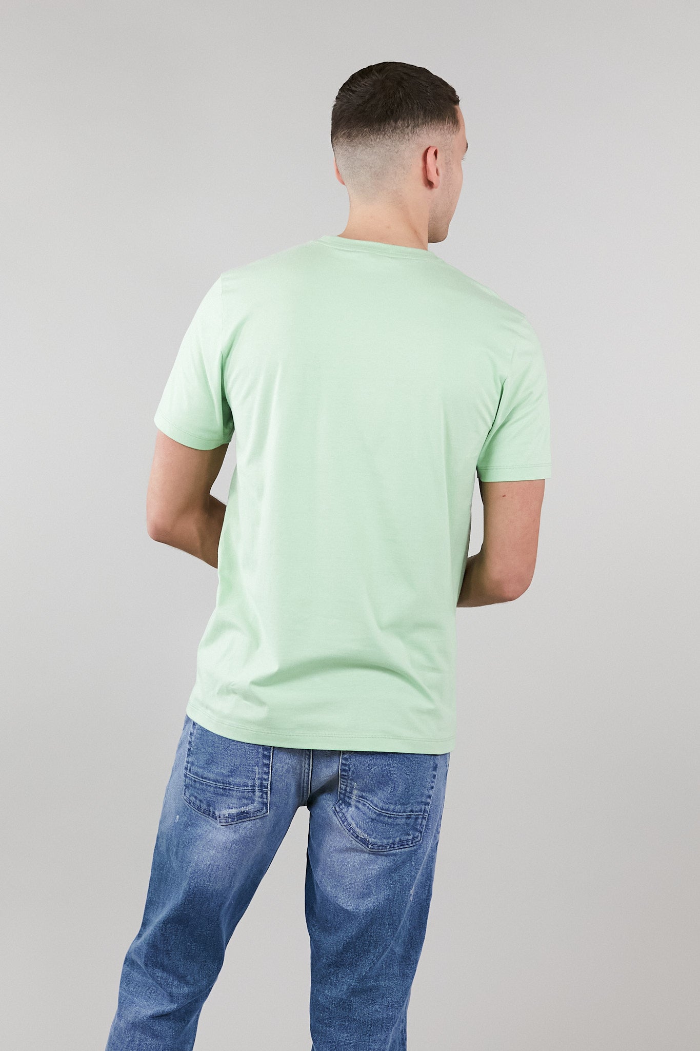Light green low carbon t-shirt made from 100% organic cotton, featuring an embroidered logo and a soft touch fabric.