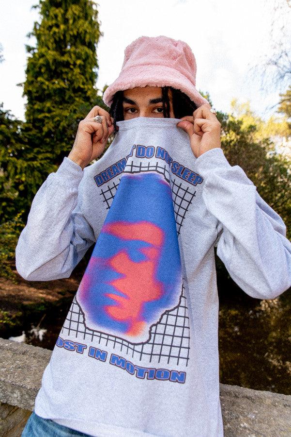 Grey long sleeved t-shirt featuring a Lost in Motion print, showcasing a relaxed fit and heavyweight cotton material.