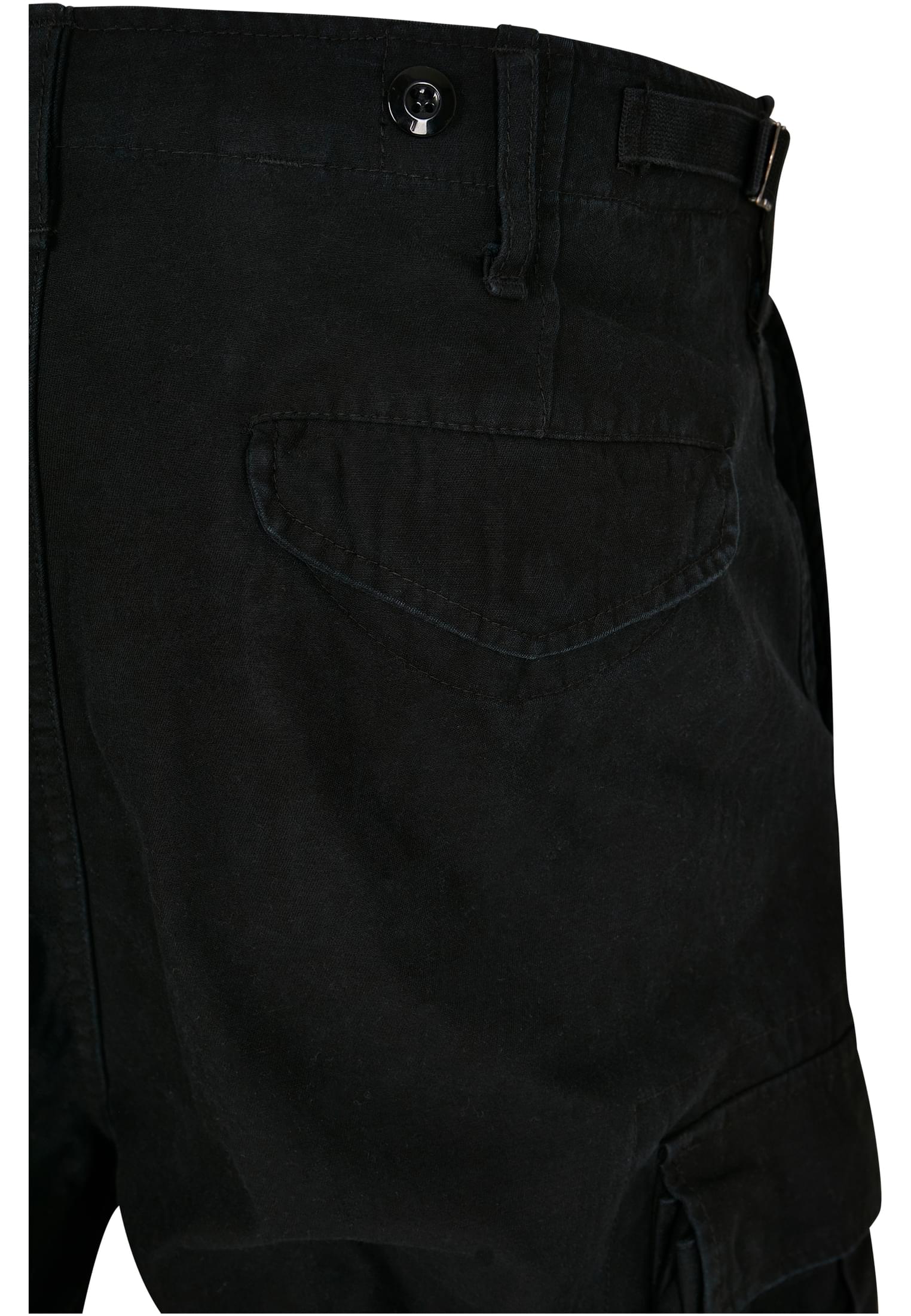 M65 Vintage Cargo Pants in a stylish urban setting, showcasing their comfortable fit and adjustable drawstrings.