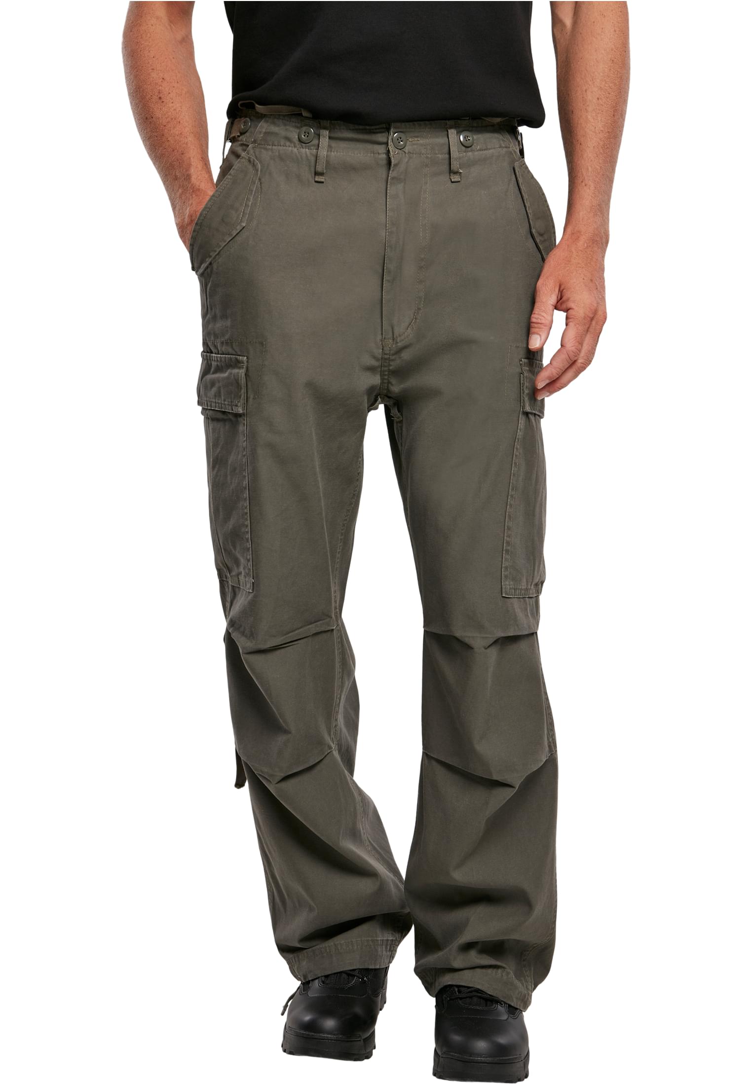 M65 Vintage Cargo Pants in a stylish urban setting, showcasing their comfortable fit and adjustable drawstrings.