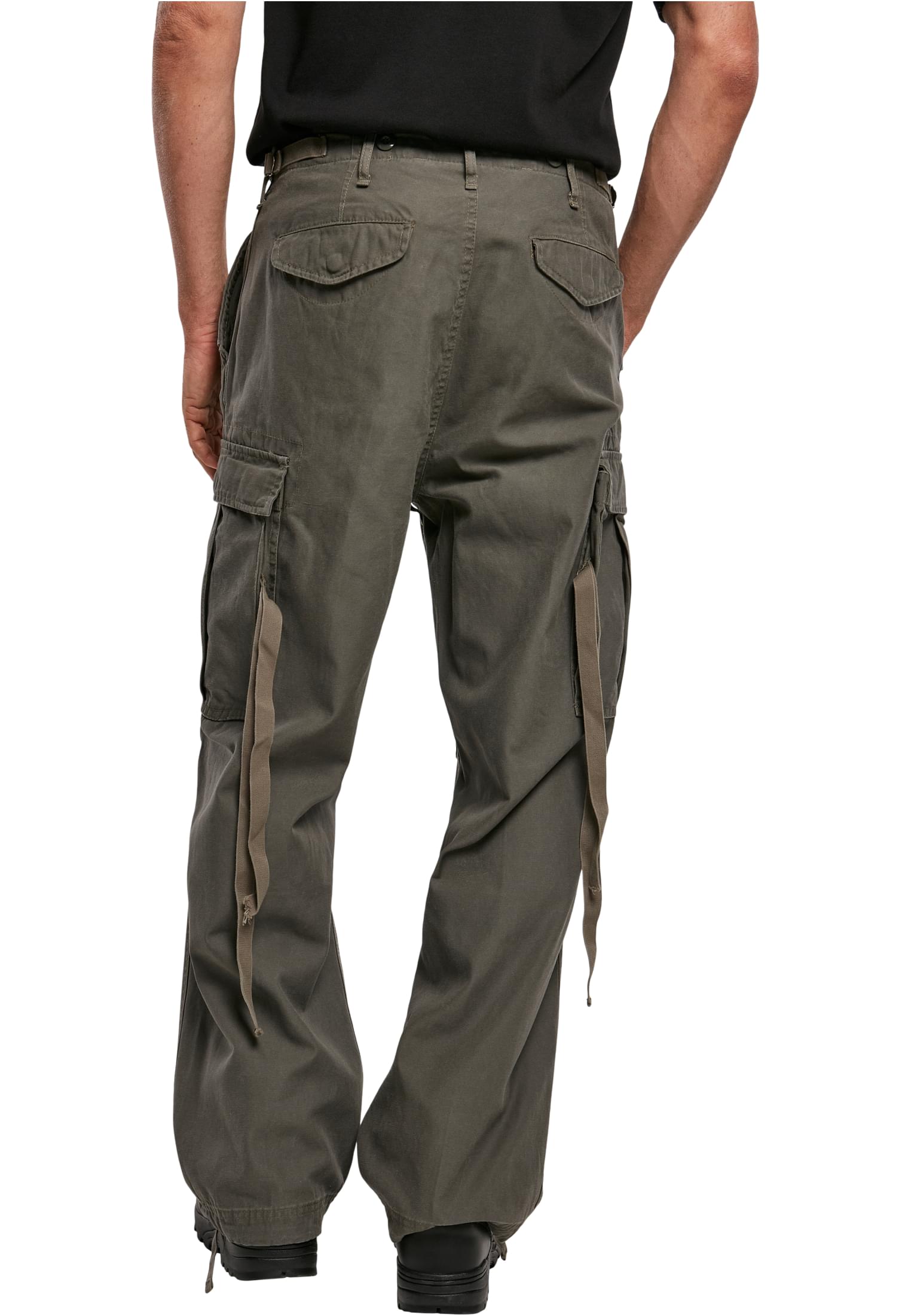 M65 Vintage Cargo Pants in a stylish urban setting, showcasing their comfortable fit and adjustable drawstrings.