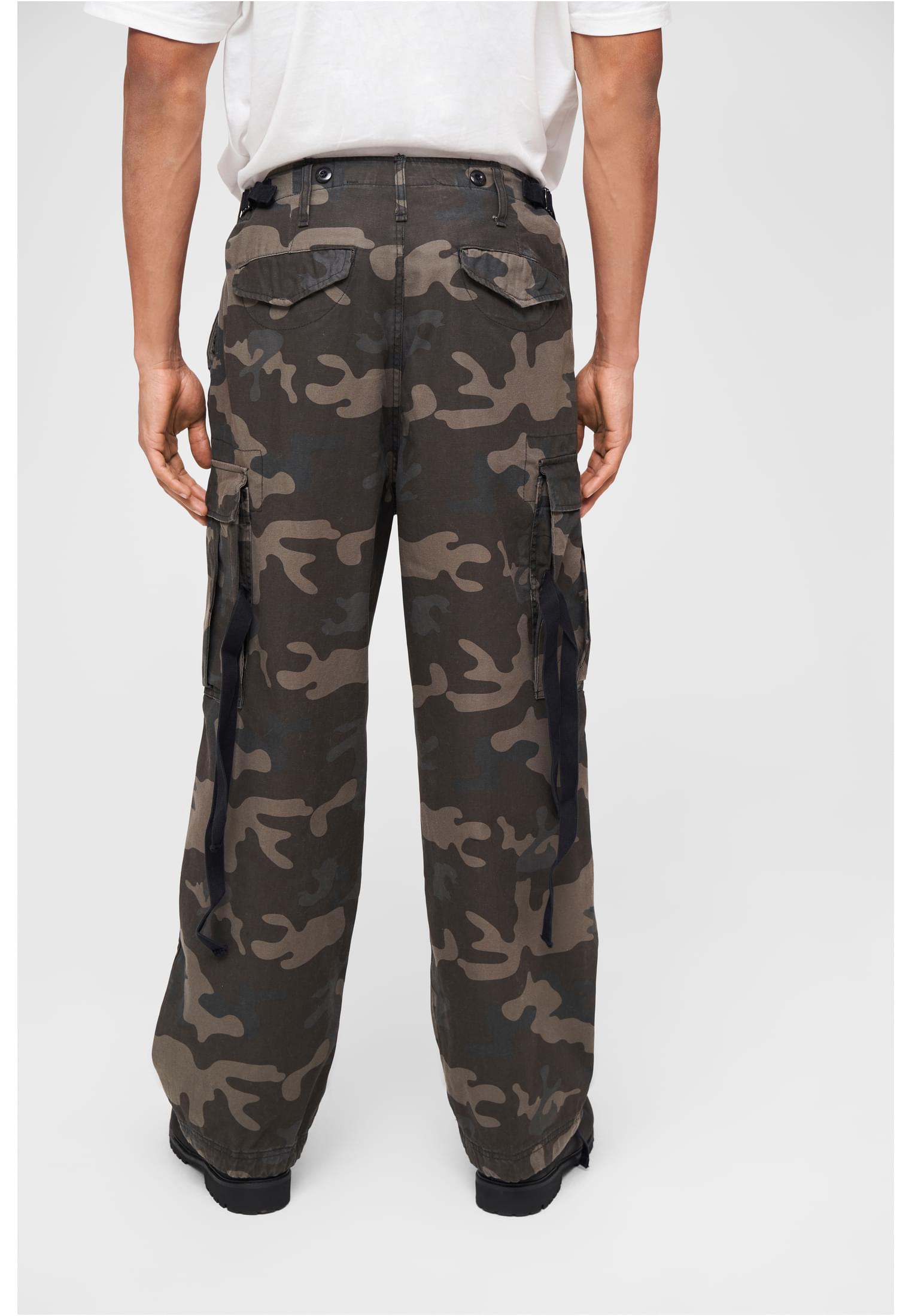 M65 Vintage Cargo Pants in a stylish urban setting, showcasing their comfortable fit and adjustable drawstrings.