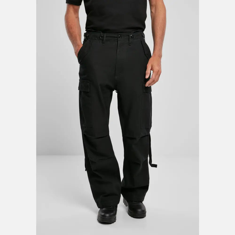 M65 Vintage Cargo Pants in a stylish urban setting, showcasing their comfortable fit and adjustable drawstrings.