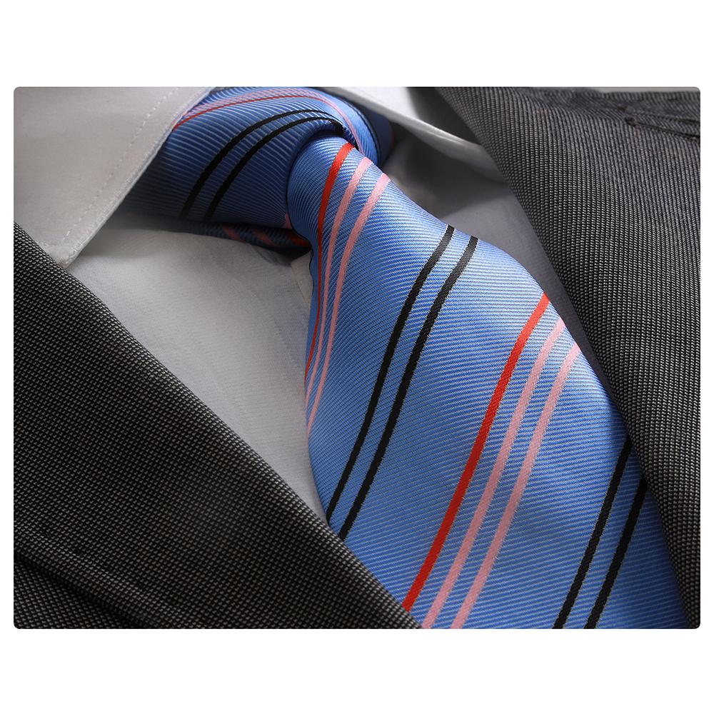 Men's jacquard necktie in blue with red, black, and pink lines, elegantly displayed in a gift box.