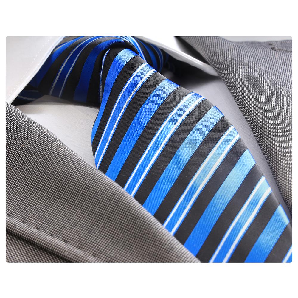 Men's Jacquard Metallic Blue and Black Lines Premium Neck Tie displayed elegantly in a gift box, showcasing its luxurious silk fabric and intricate design.