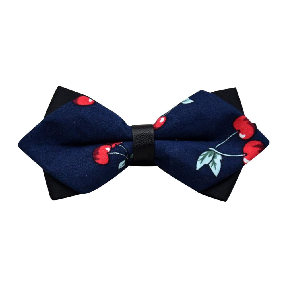 Men's navy blue pre-tied bow tie with red cherries pattern, made from 100% cotton, elegantly displayed in protective packaging.