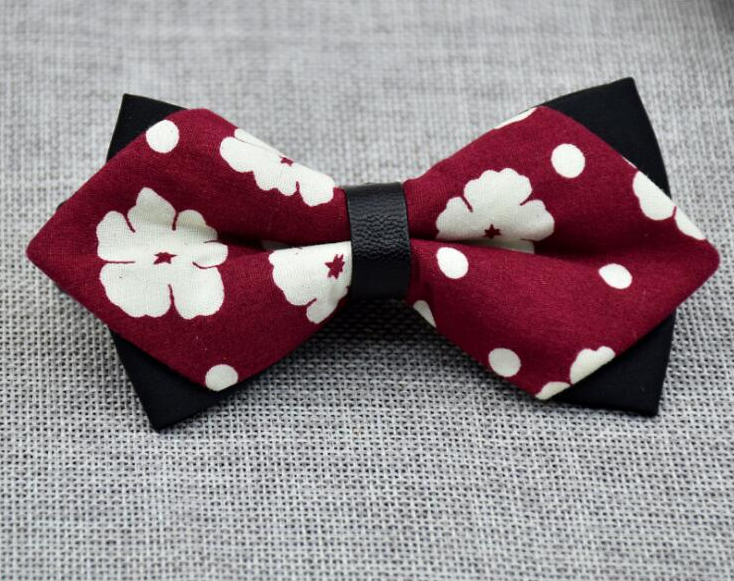 Men's pre-tied bow tie featuring a stylish red, black, and white dots pattern, perfect for formal occasions.
