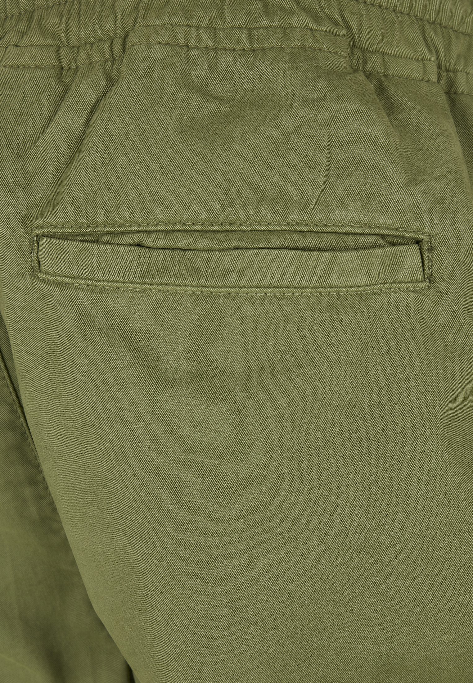 Men's Military Jog Pants made from durable cotton twill, featuring cargo pockets and adjustable waistband.