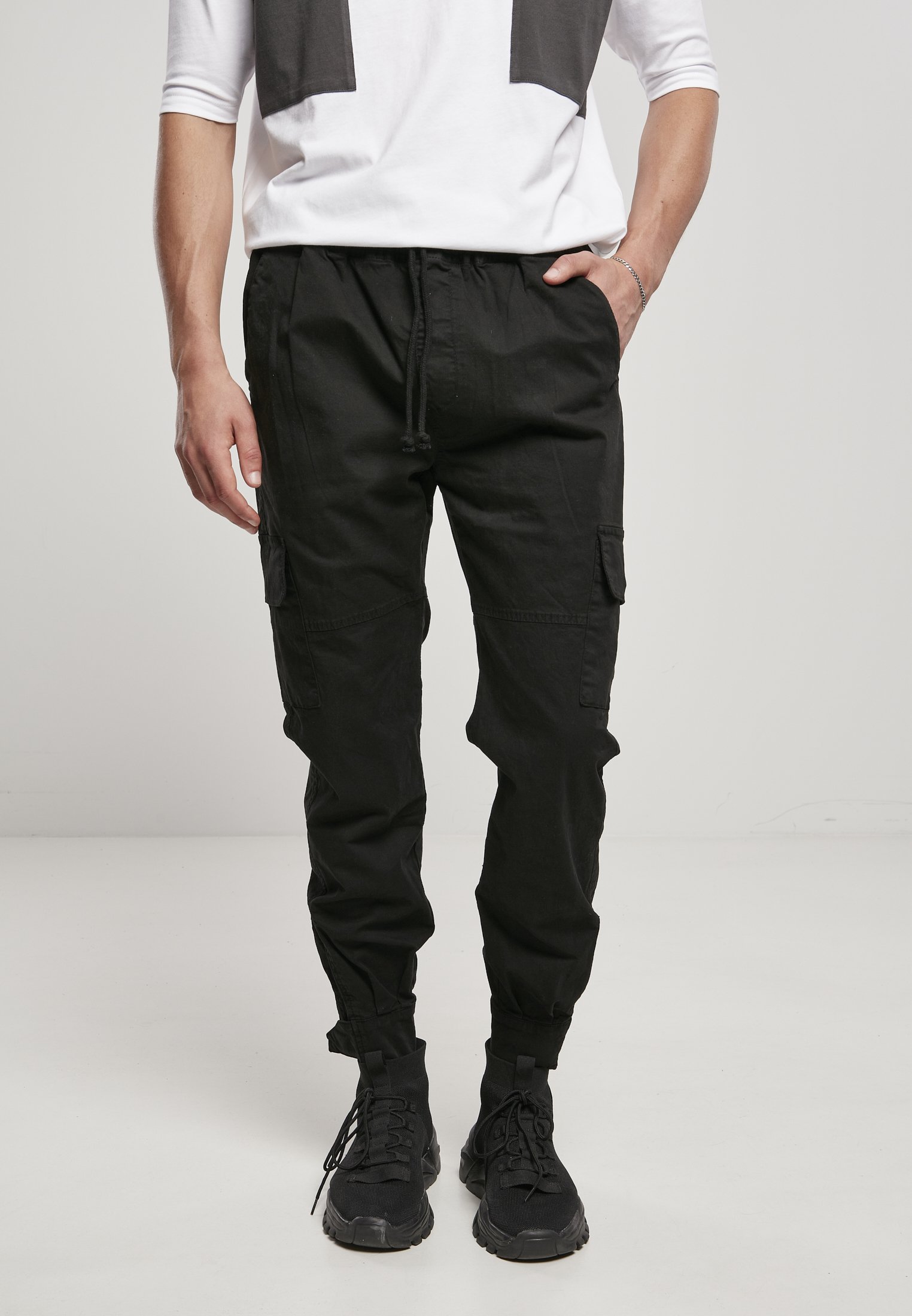 Men's Military Jog Pants made from durable cotton twill, featuring cargo pockets and adjustable waistband.
