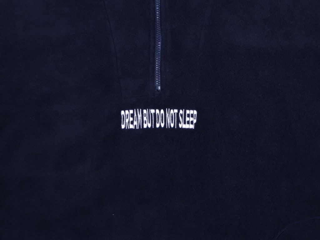 Navy blue fleece sweatshirt featuring 'Dream But Do Not Sleep' embroidered design on the front, showcasing cozy fleece material and relaxed fit.