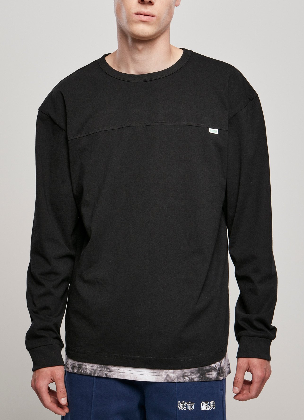 Men's Organic Cotton Short Curved Oversized Longsleeve in a casual style with wide cuffs and a stepped round neckline.